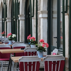 Restarurant tables along a corridor in the old city.