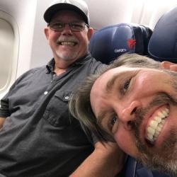 Greg and Chad happy to be on the plane to Egypt.