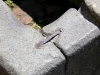 Metal ties that hold stone blocks together.