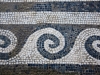 Detailed mosaics lined floors and walkways in this giant home.