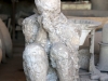 The plaster cast of one of Vesuvius\' victims.